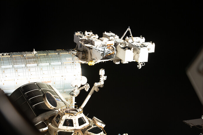 Astronaut Kayla Barron peers out from a window inside the cupola